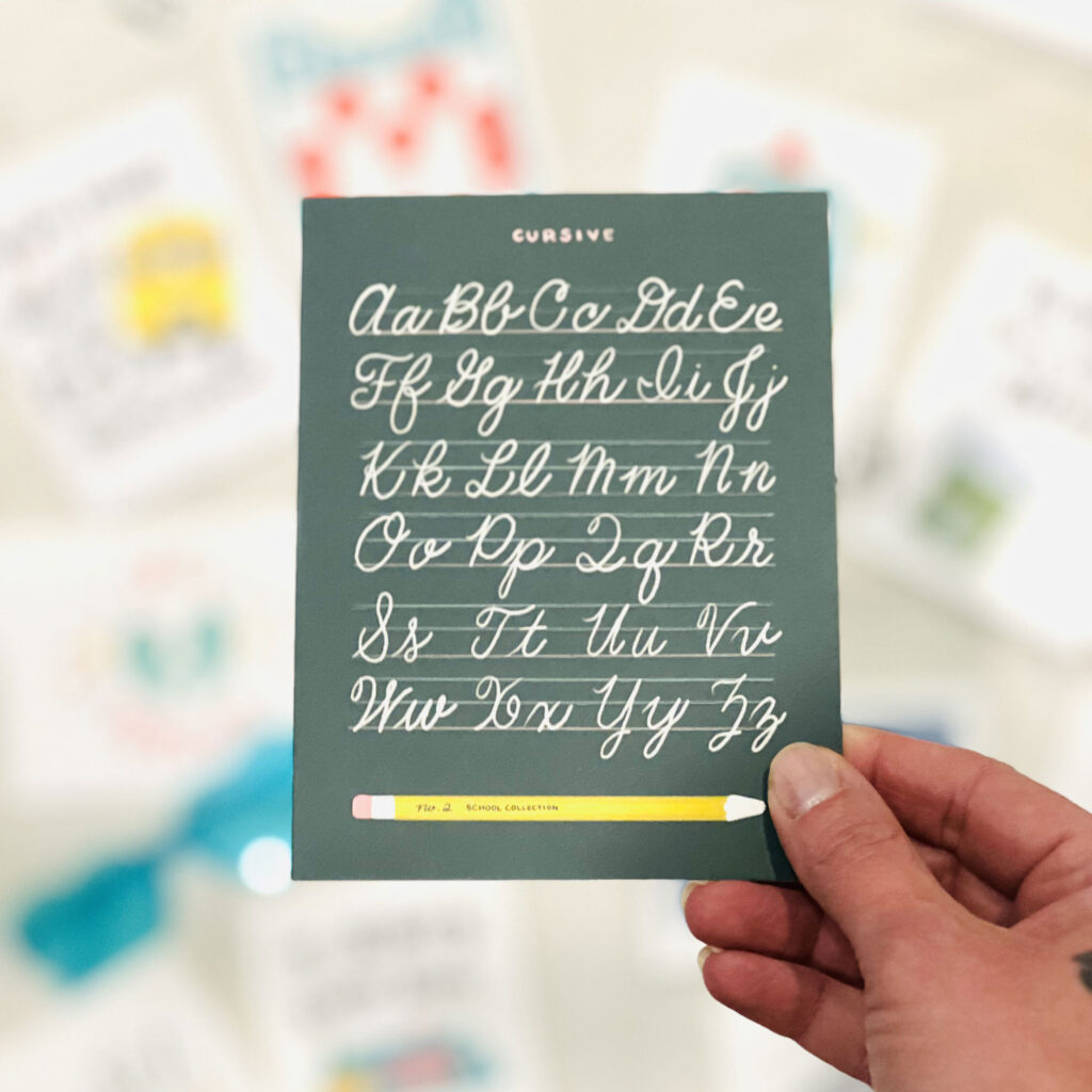 FC.056_cursive-alphabet_greeting-card_Promo_web Cursive Alphabet Greeting Card in hand
