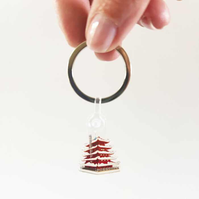 Reading Pagoda Acrylic Keychain in hand